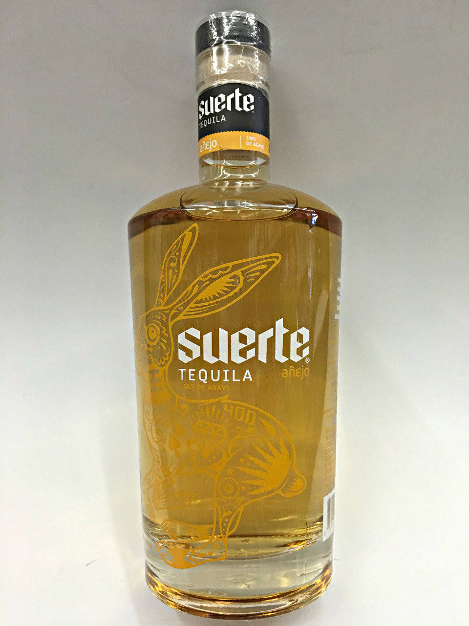 Suerte Tequila Gold Anejo Background