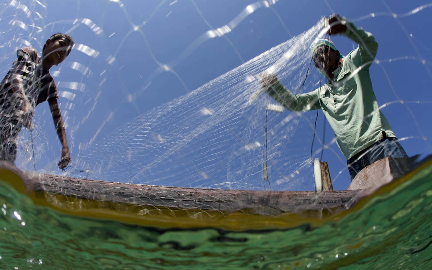 Sulawesi Fishermen Casting Their Net