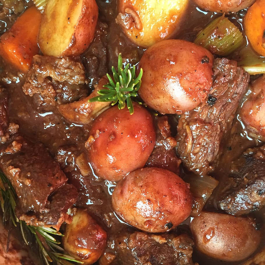 Sumptuous Beef Bourguignon Stew Served With Onion Garnish Background