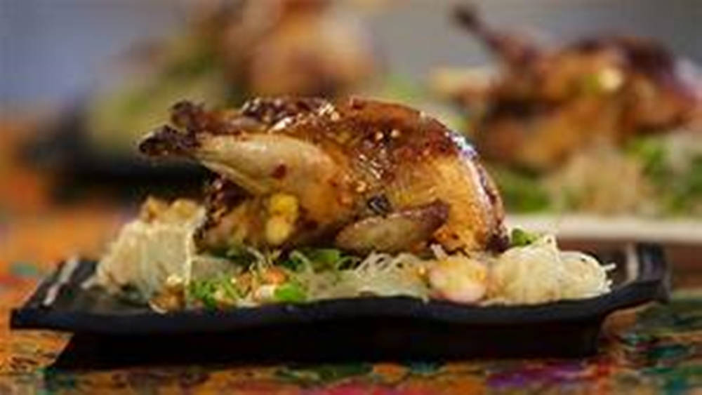 Sumptuous Grilled Quail On A Vegetable Platter Background