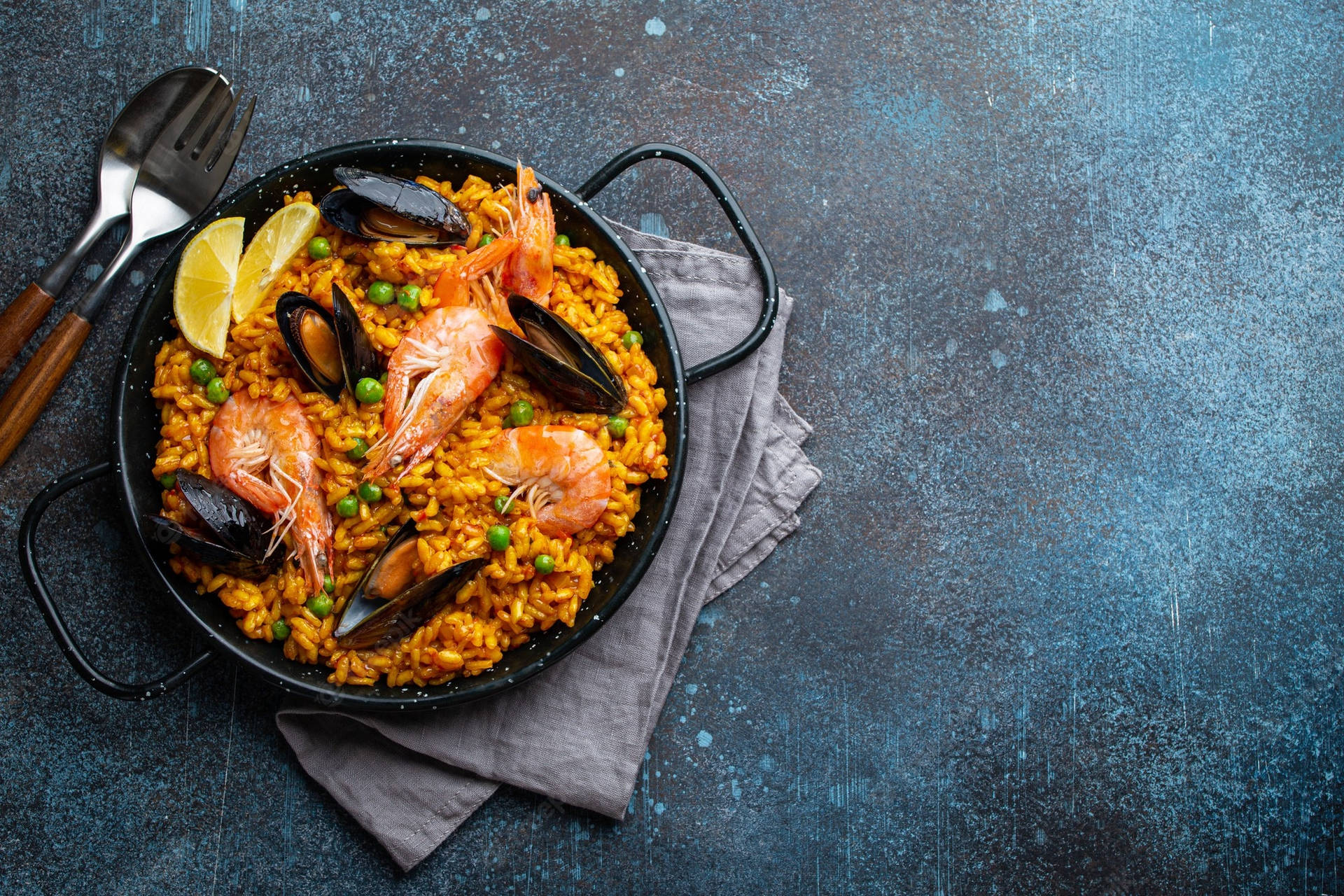 Sumptuous Paella Dish In Traditional Spanish Pan Background