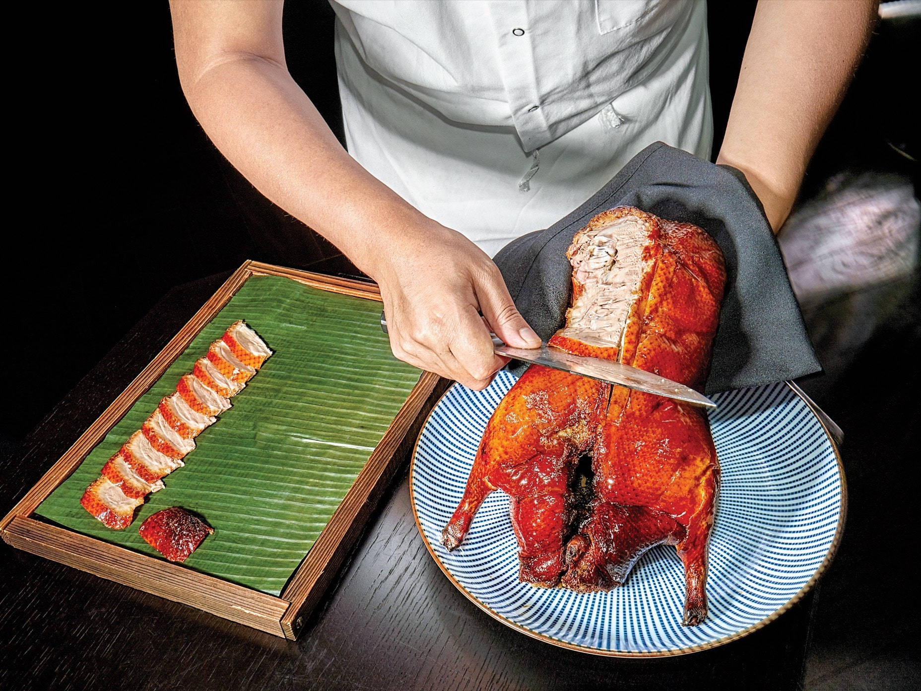 Sumptuous Roasted Peking Duck In Small Slices Background