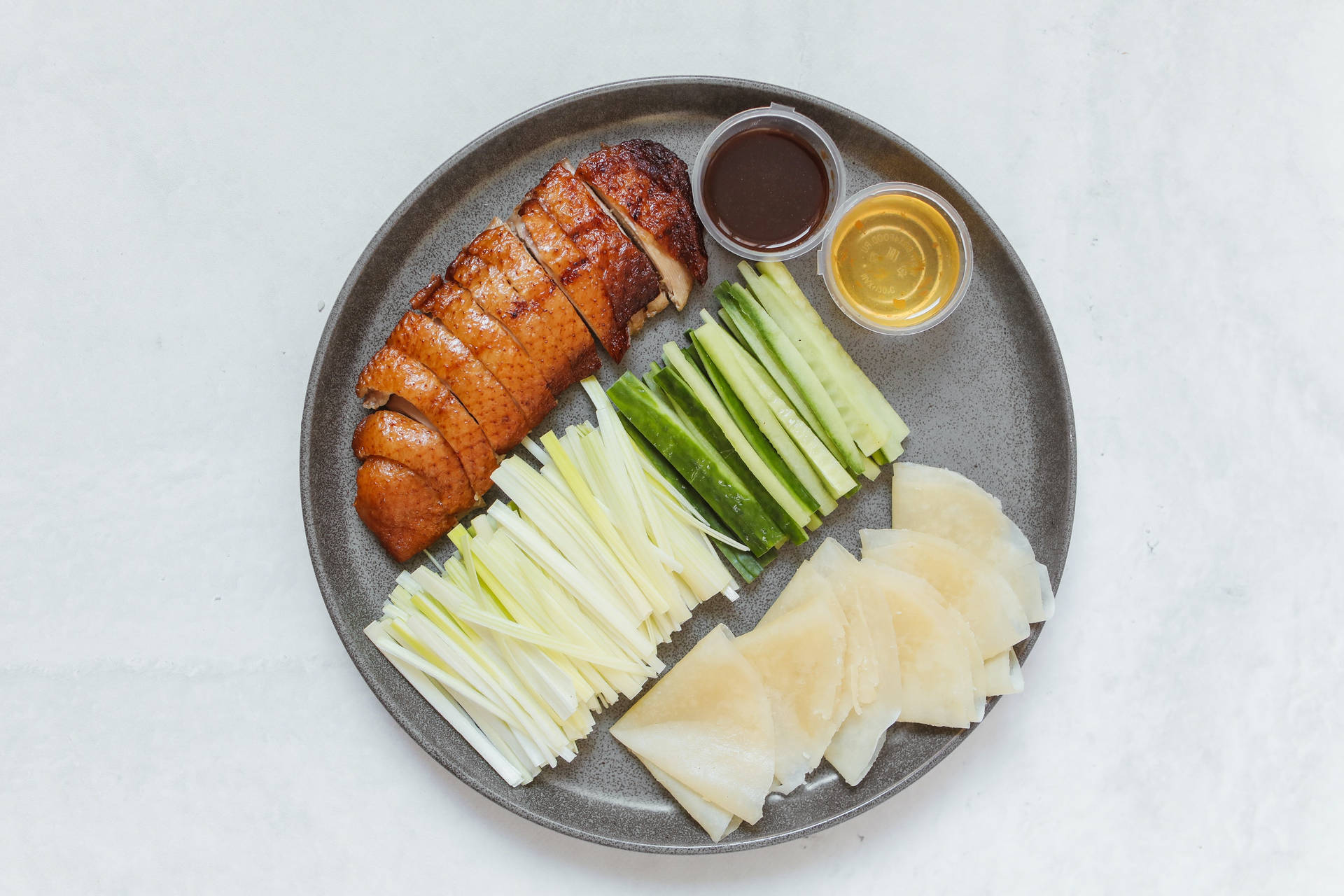 Sumptuous Sliced Peking Duck Ready To Serve Background