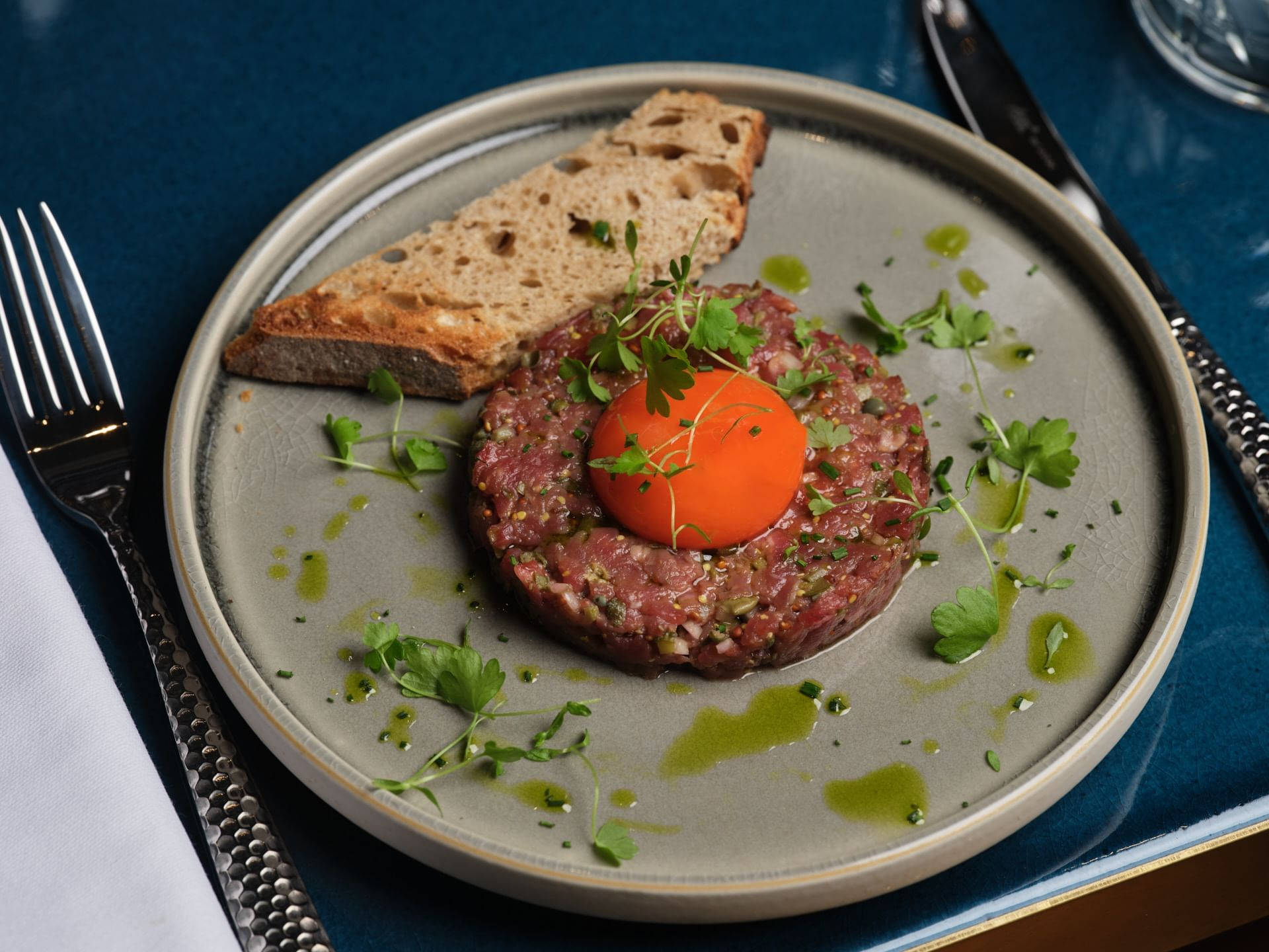 Sumptuous Steak Tartare Adorned With A Fresh Egg Yolk Background