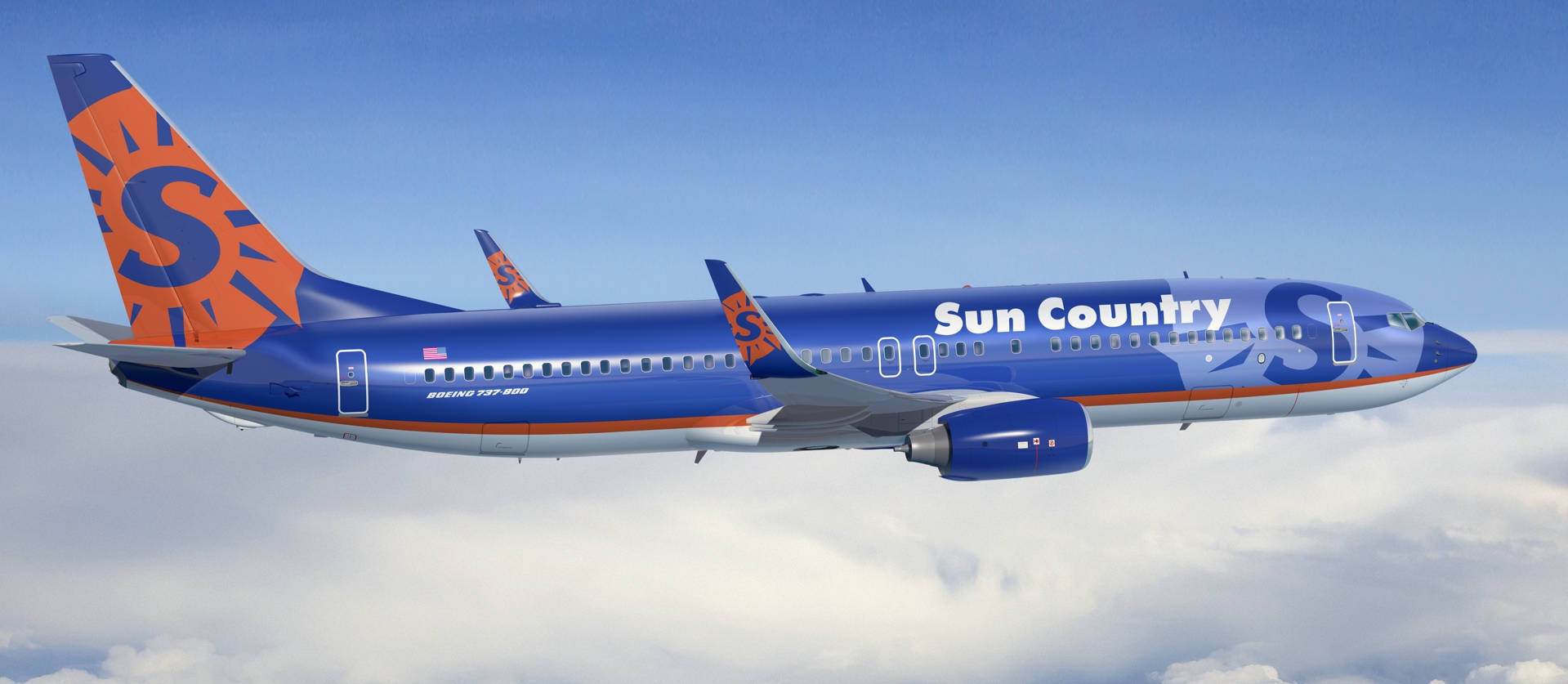 Sun Country Aircraft Above Clouds Background