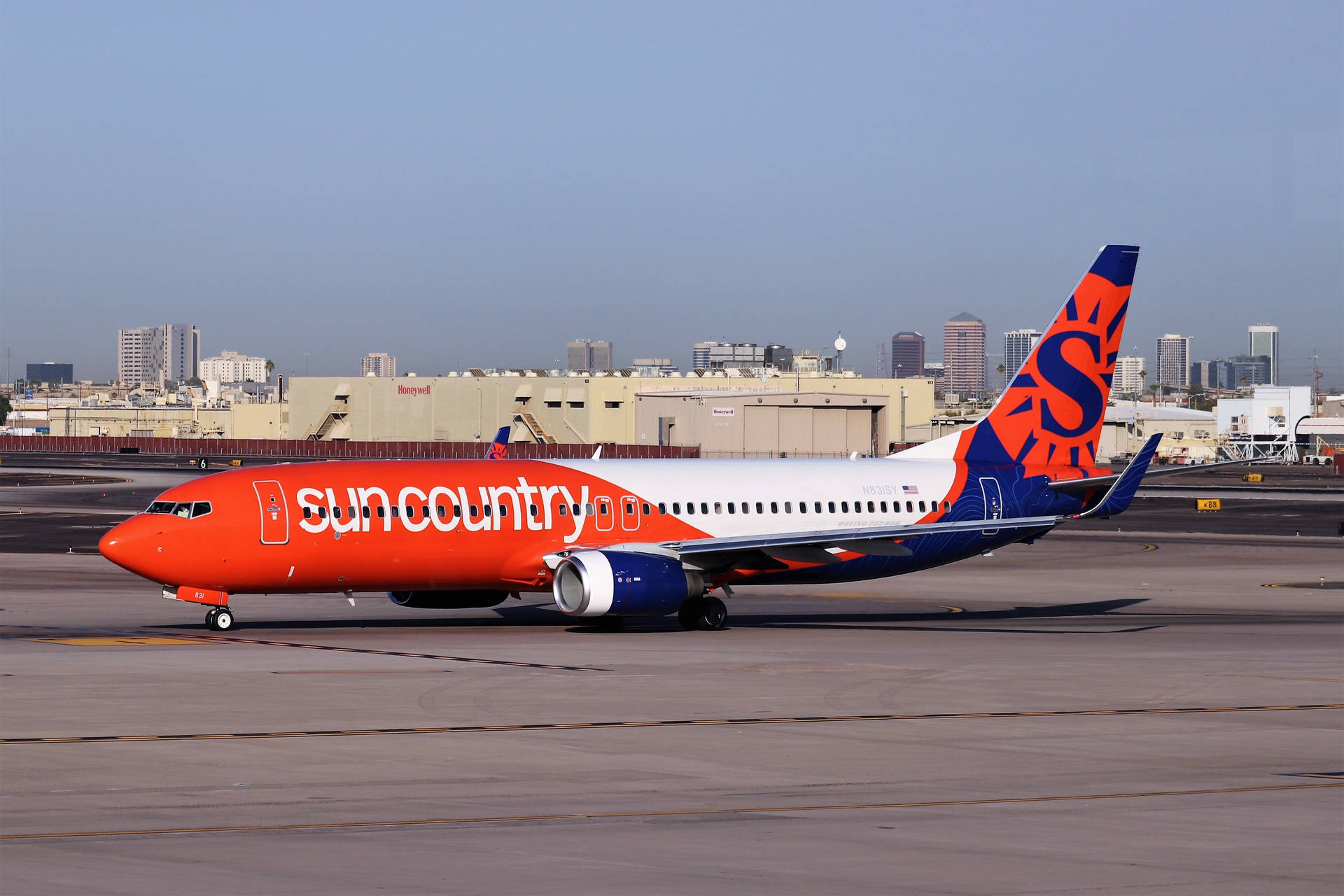 Sun Country Aircraft At Minneapolis Airport Background