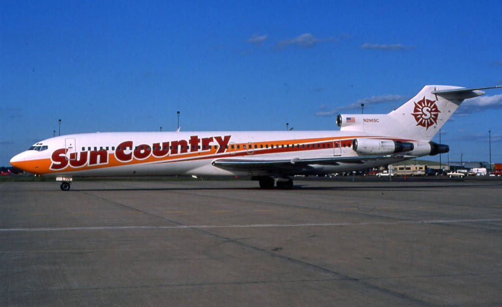 Sun Country Aircraft In The Airport Background