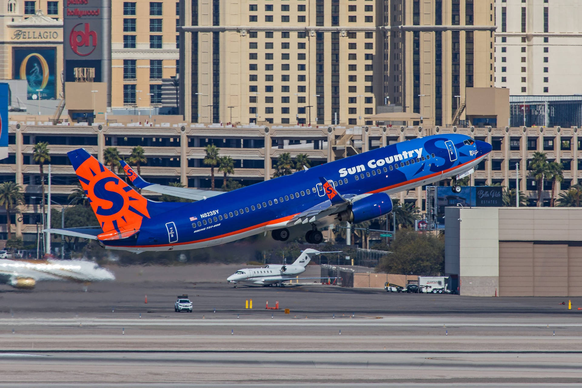 Sun Country Aircraft Takeoff In Las Vegas Background