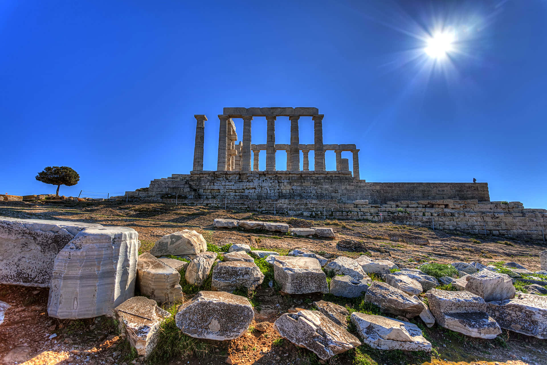 Sun In Sky Over Sounion Background