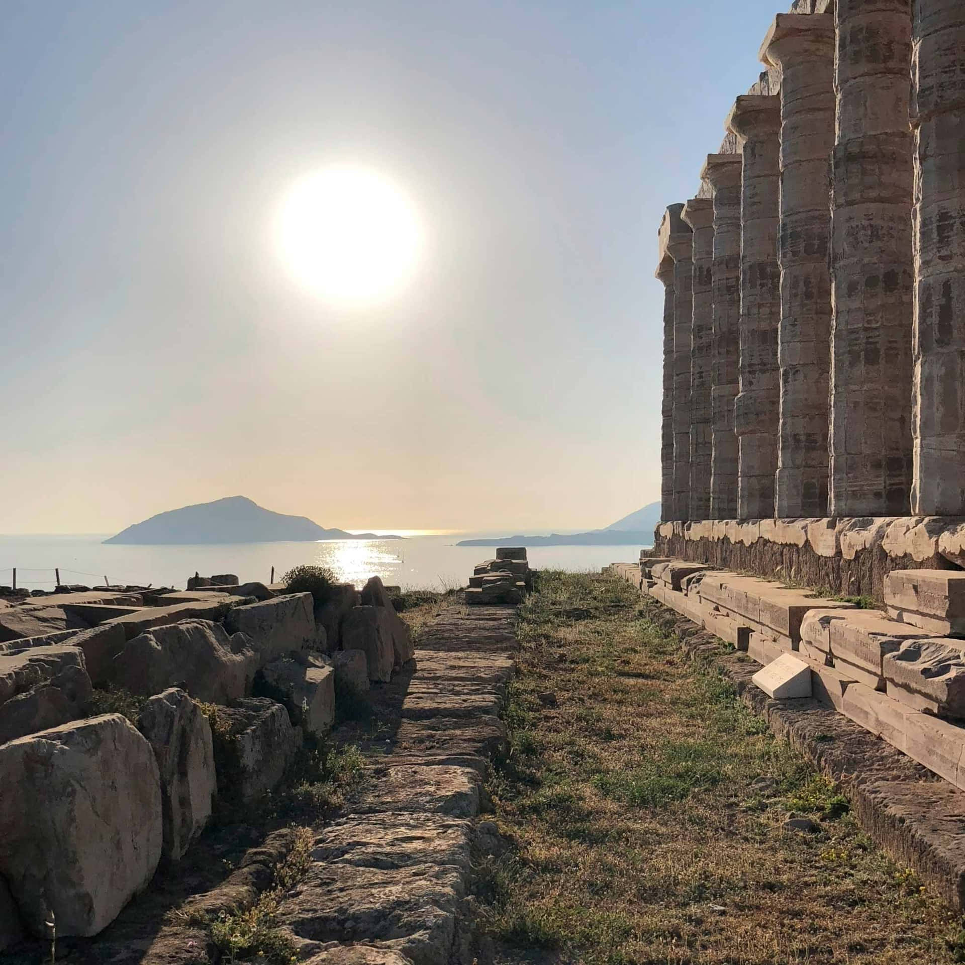 Sun In Sky Over Sounion Background