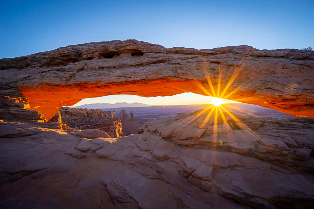 Sun Peeking Under Delicate Arch