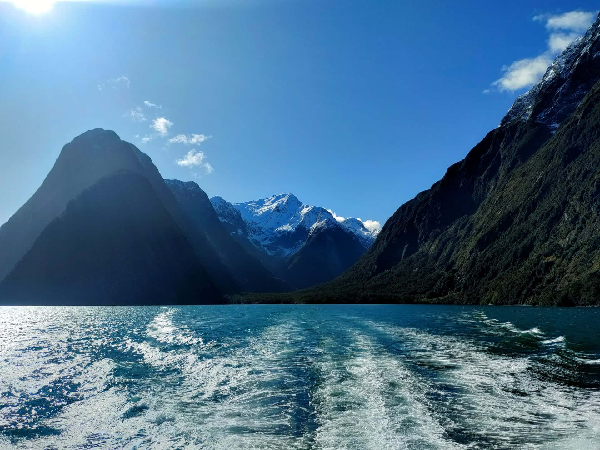 Sun Shining Over Milford Sound Background