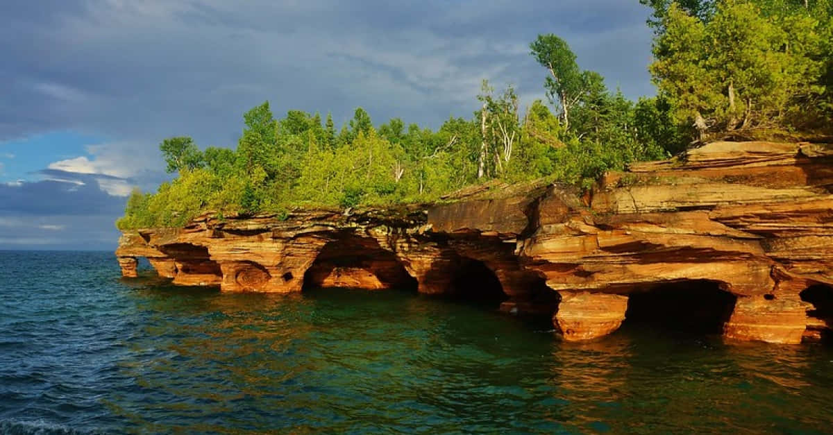 Sunlit_ Cliffside_ Over_ Water