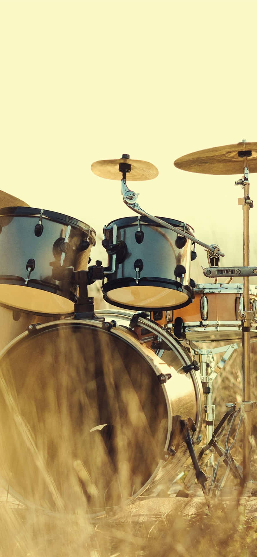 Sunlit Drum Set Outdoor Scene Background