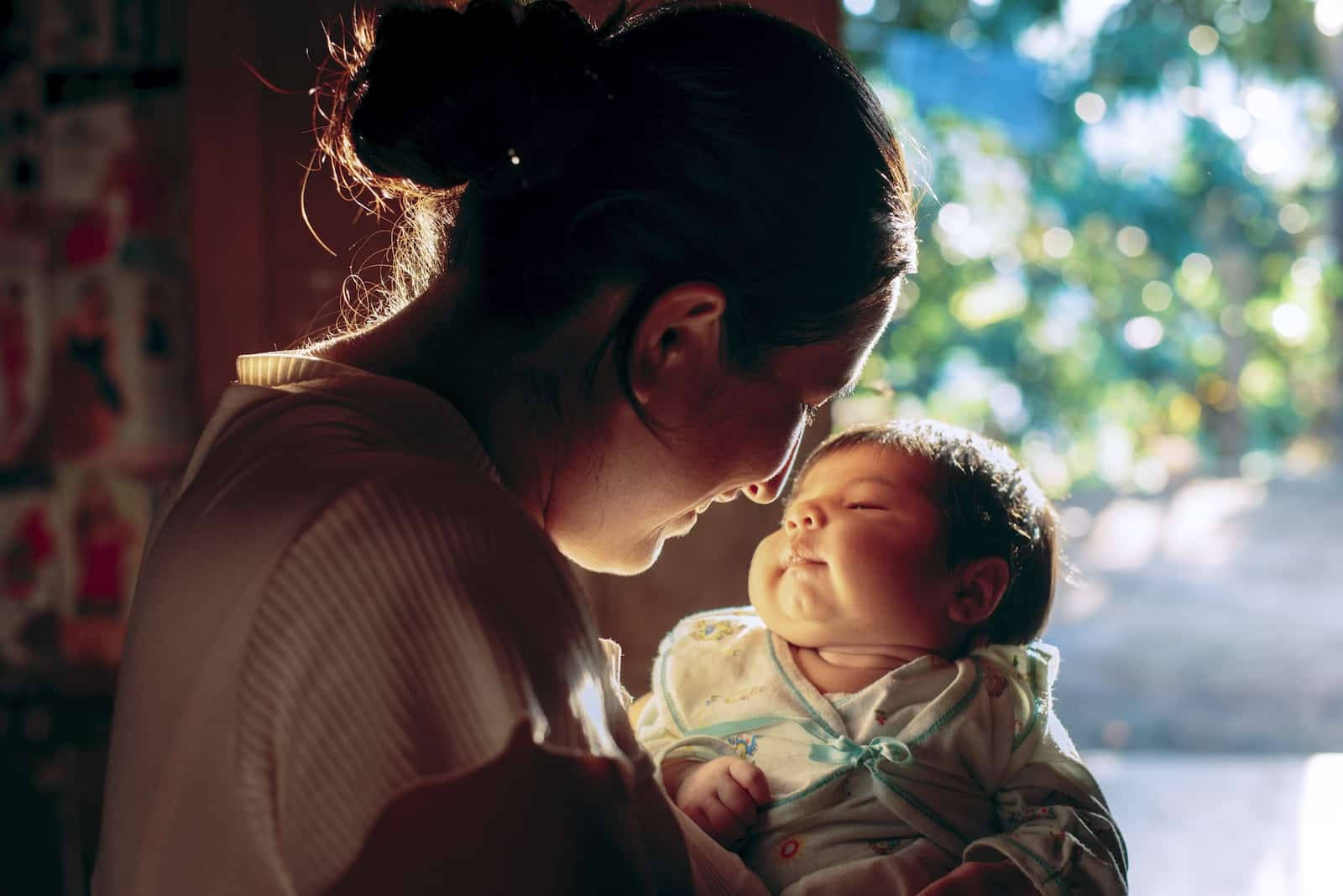 Sunlit Mother And Baby Background