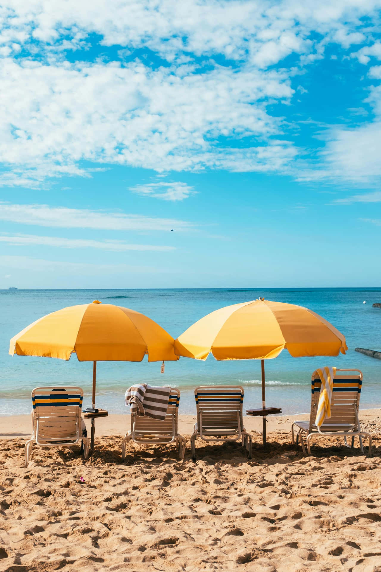 Sunny Beach Umbrellasand Chairs Background