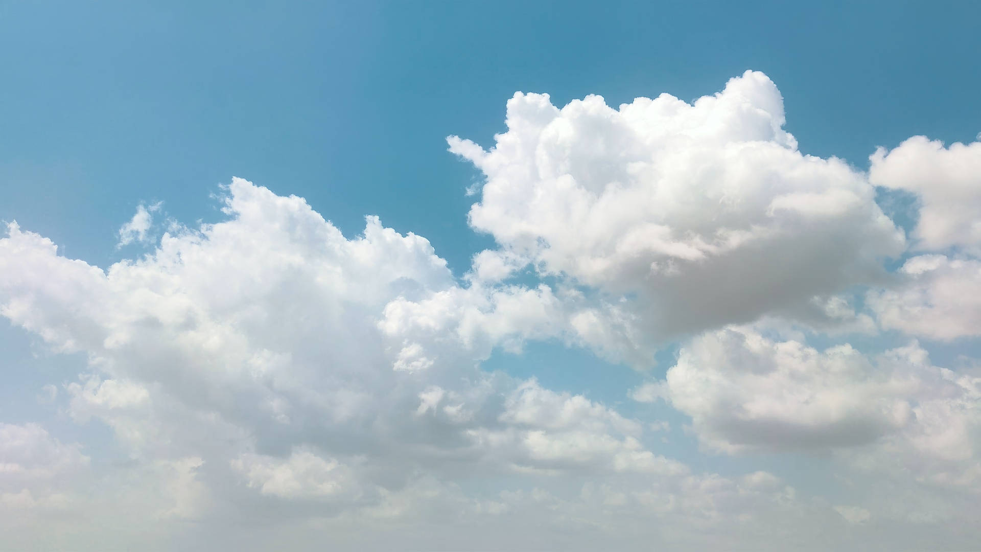 Sunny Bright Blue Cloudy Sky Background