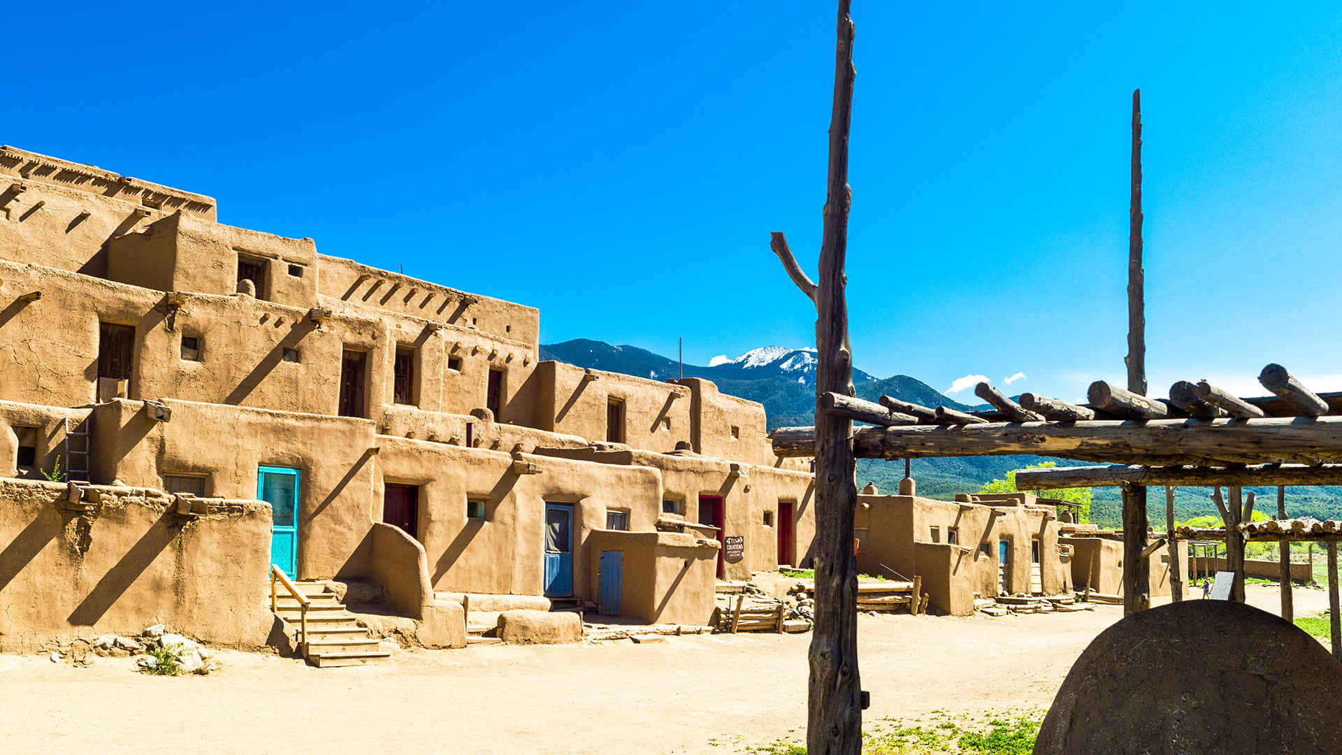 Sunny Day In Taos Pueblo Background