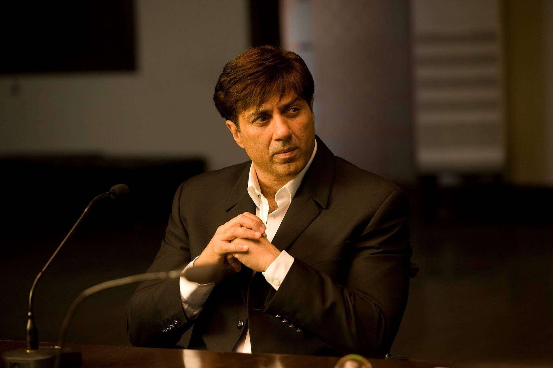 Sunny Deol In Black Suit Background
