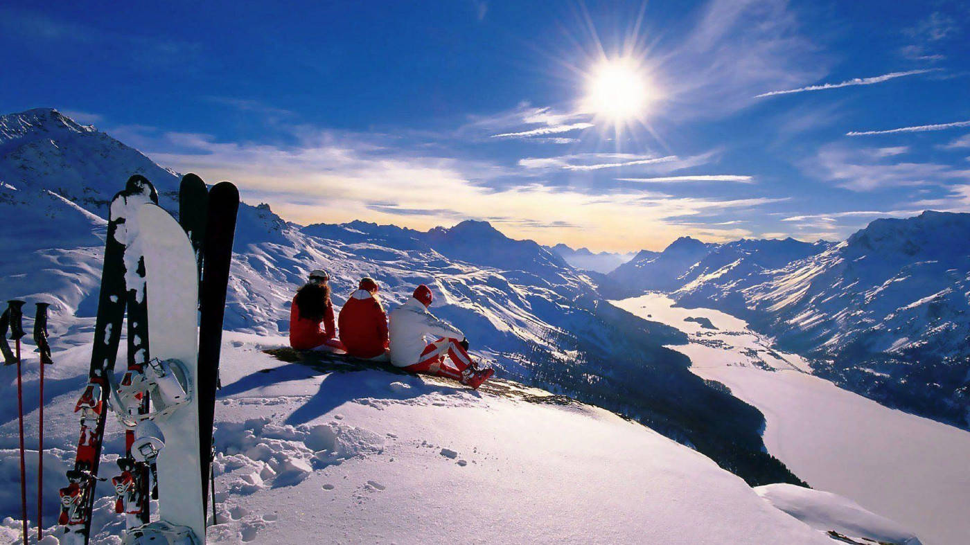 Sunrise With Snowboard Planted In The Snow