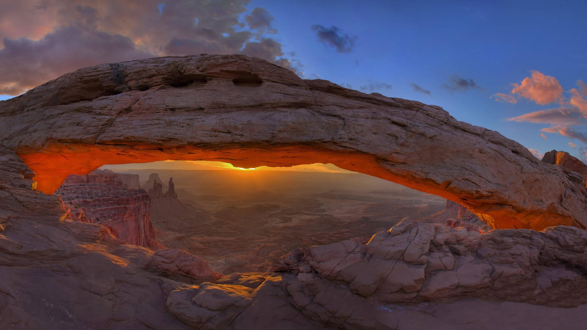 Sunset Arch In Canyonlands National Park Background