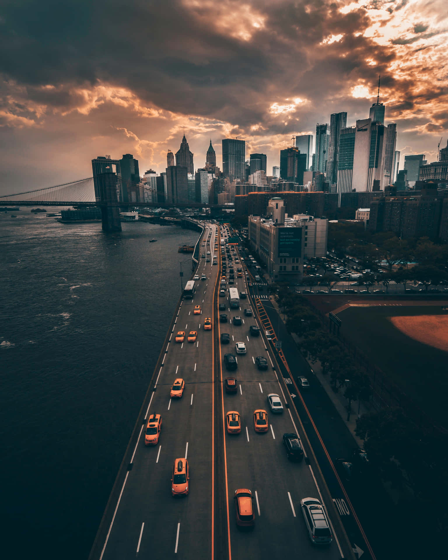 Sunset_ Cityscape_with_ Bridge_and_ Highway.jpg Background