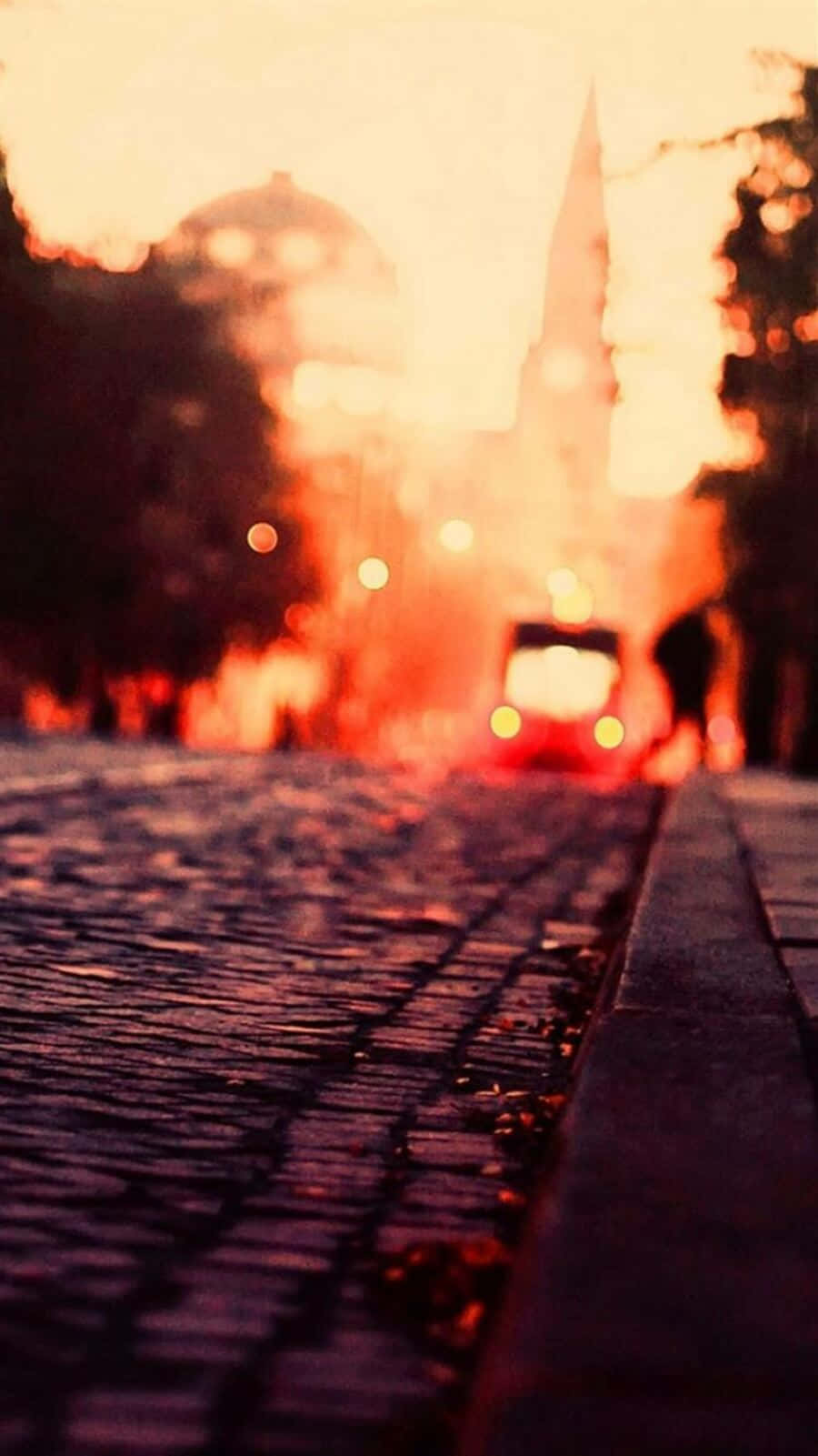 Sunset Hued Cityscape Blur Background