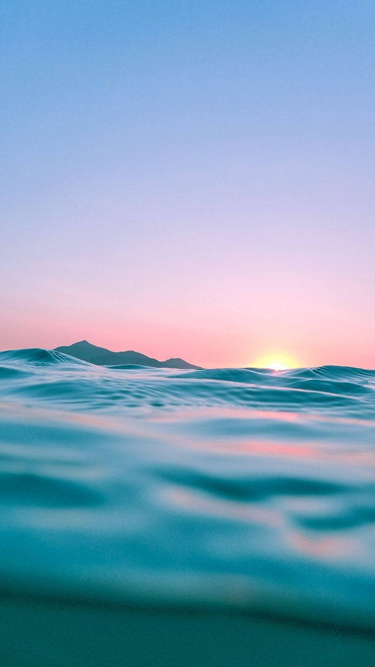 Sunset Iphone Display Of Ocean Background