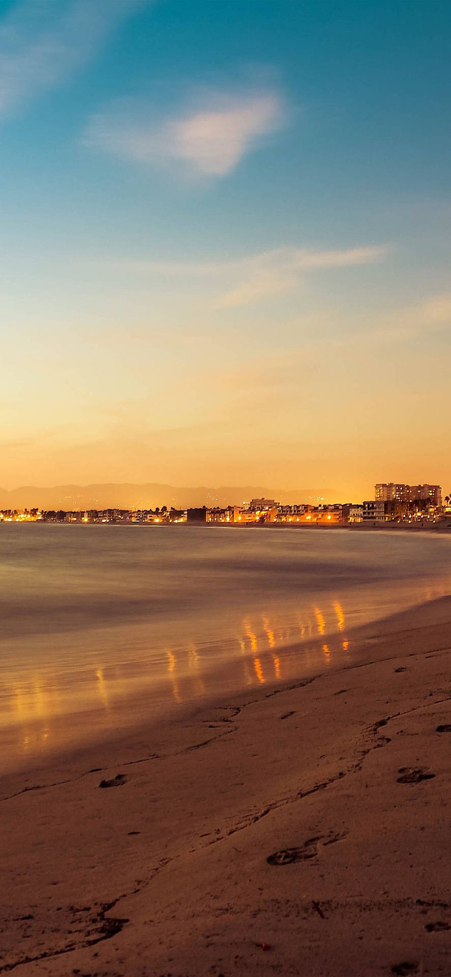 Sunset Ocean Distant Town Background