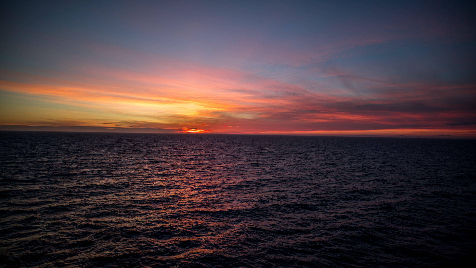 Sunset Ocean Growing Darker Background