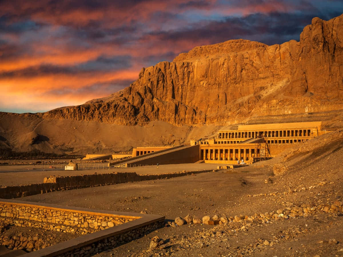 Sunset_ Over_ Ancient_ Egyptian_ Temple_ Valley_of_the_ Kings Background