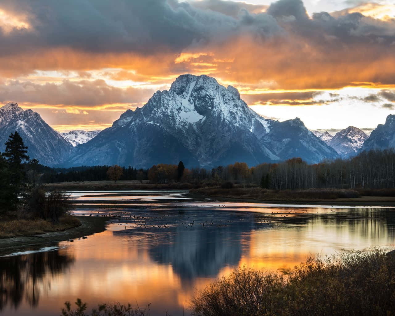 Sunset Over The Grand Teton Mountains Background