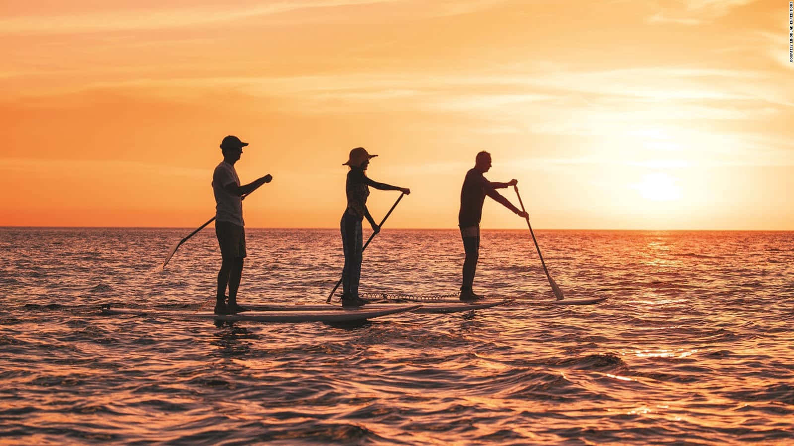 Sunset Paddleboarding Wellness Activity Background