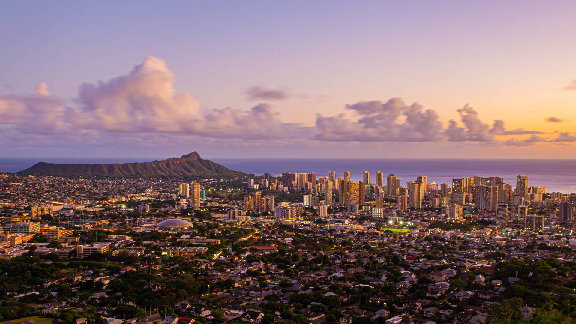 Sunset Sky Over City In Oahu Background