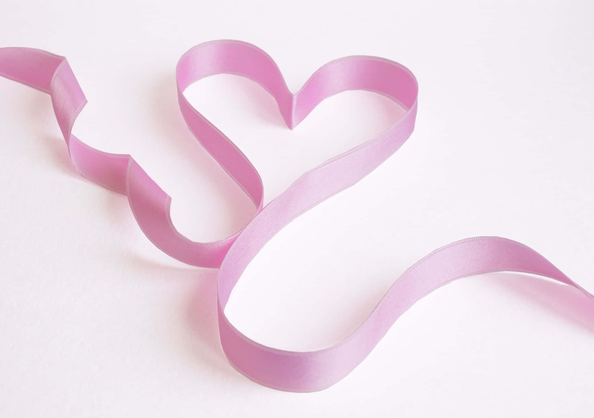 Supportive Pink Ribbon On Texture Background