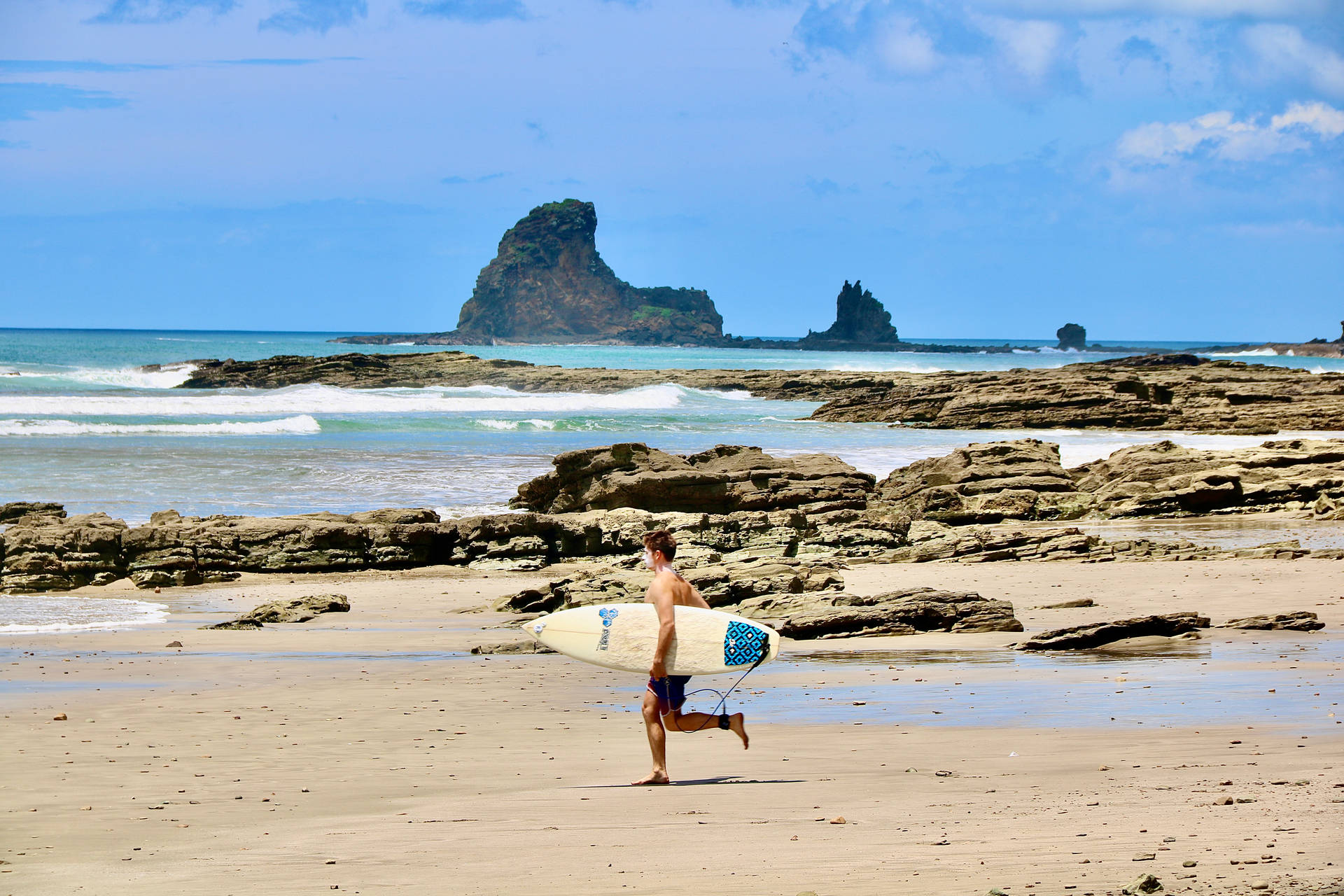Surfer In Nicaragua Island Background