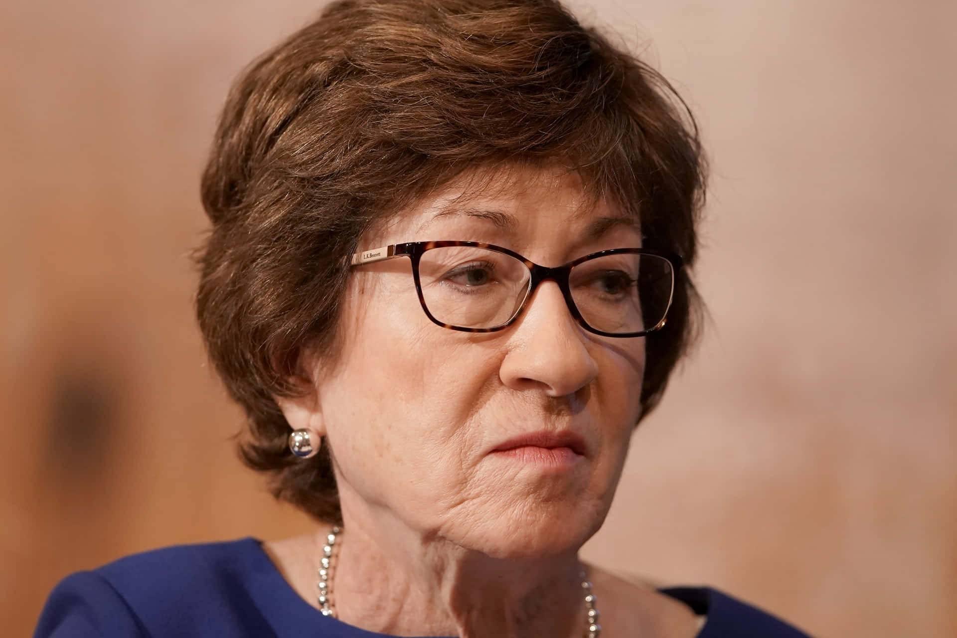 Susan Collins Frown Background