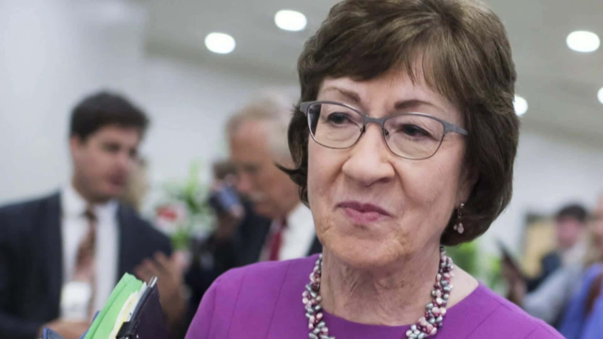 Susan Collins Wearing Glasses Background