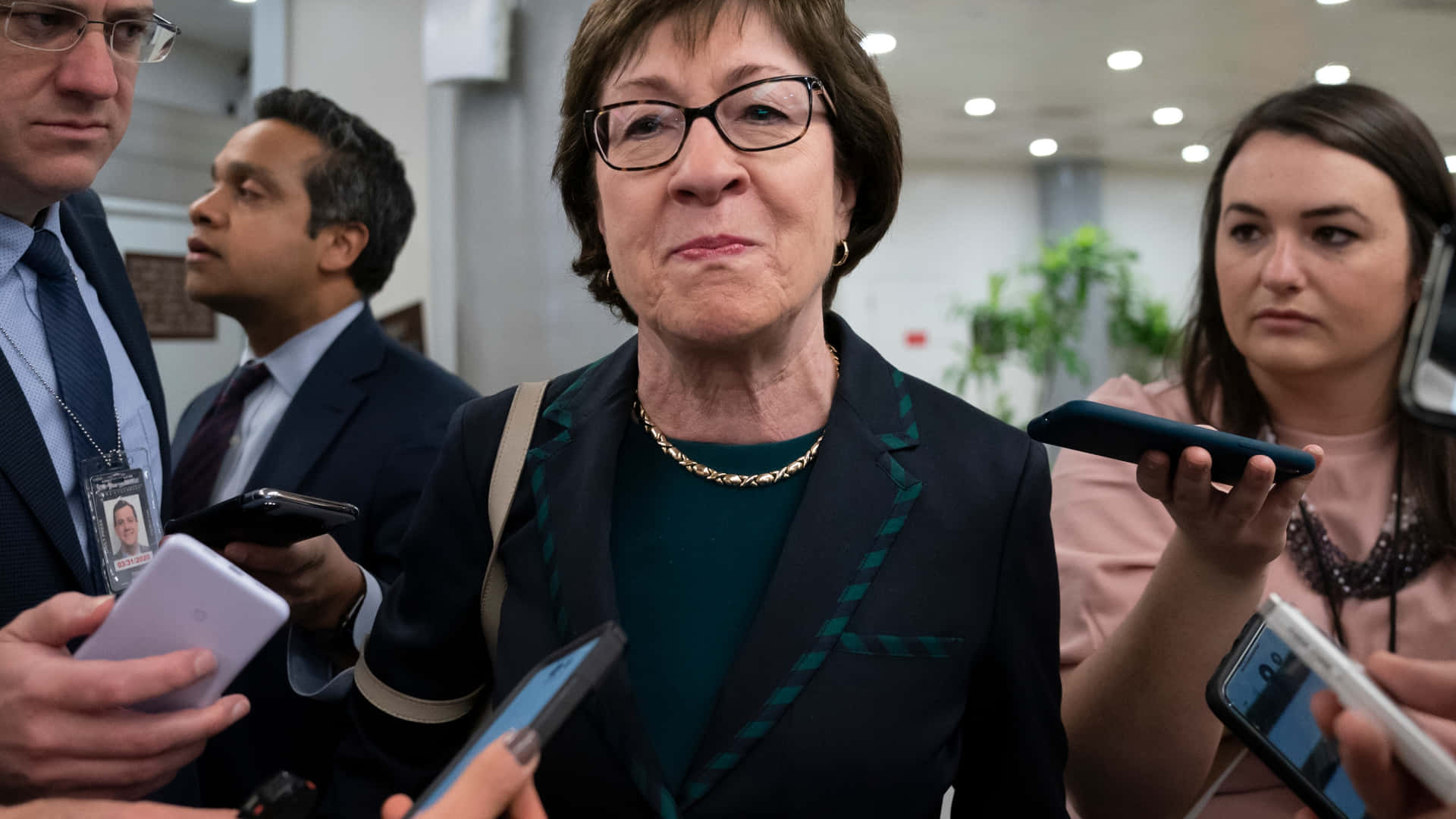 Susan Collins With Reporters Background