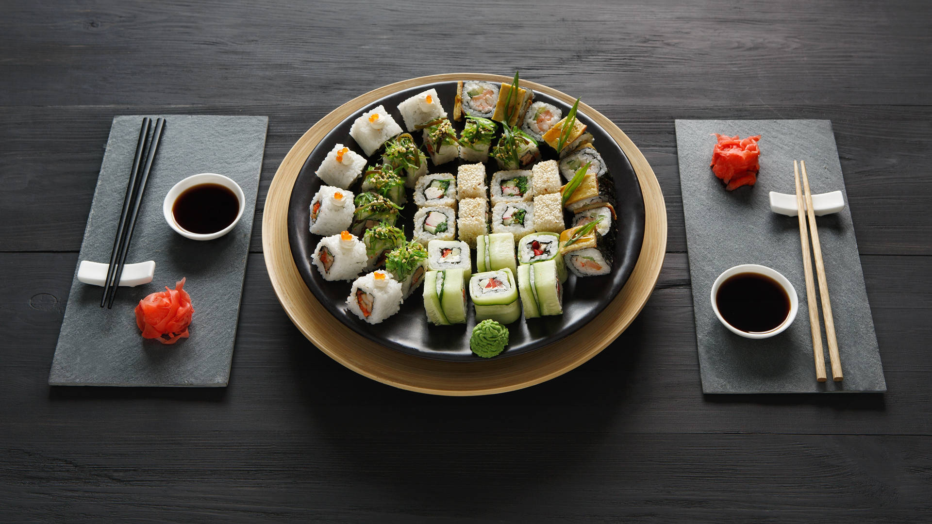 Sushi Bar On Black Plate Background
