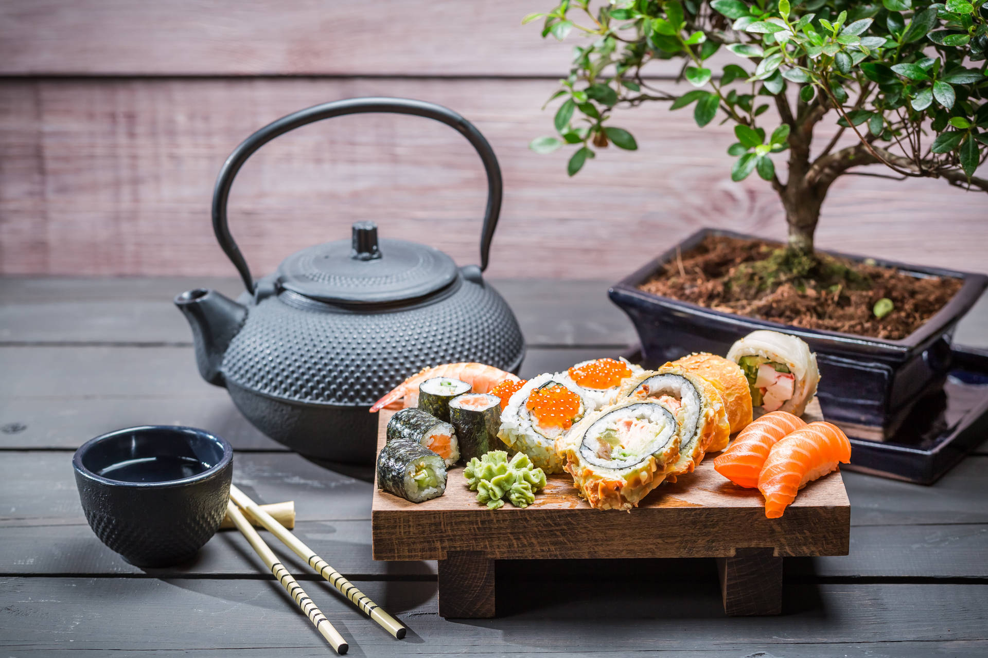 Sushi Platter With Black Teapot Background