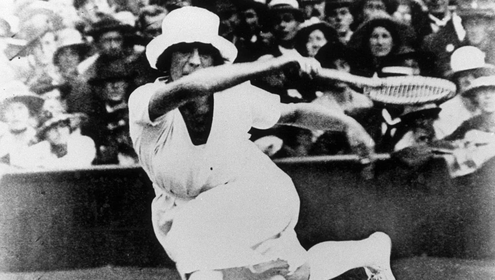 Suzanne Lenglen In Action During A Tennis Match Background