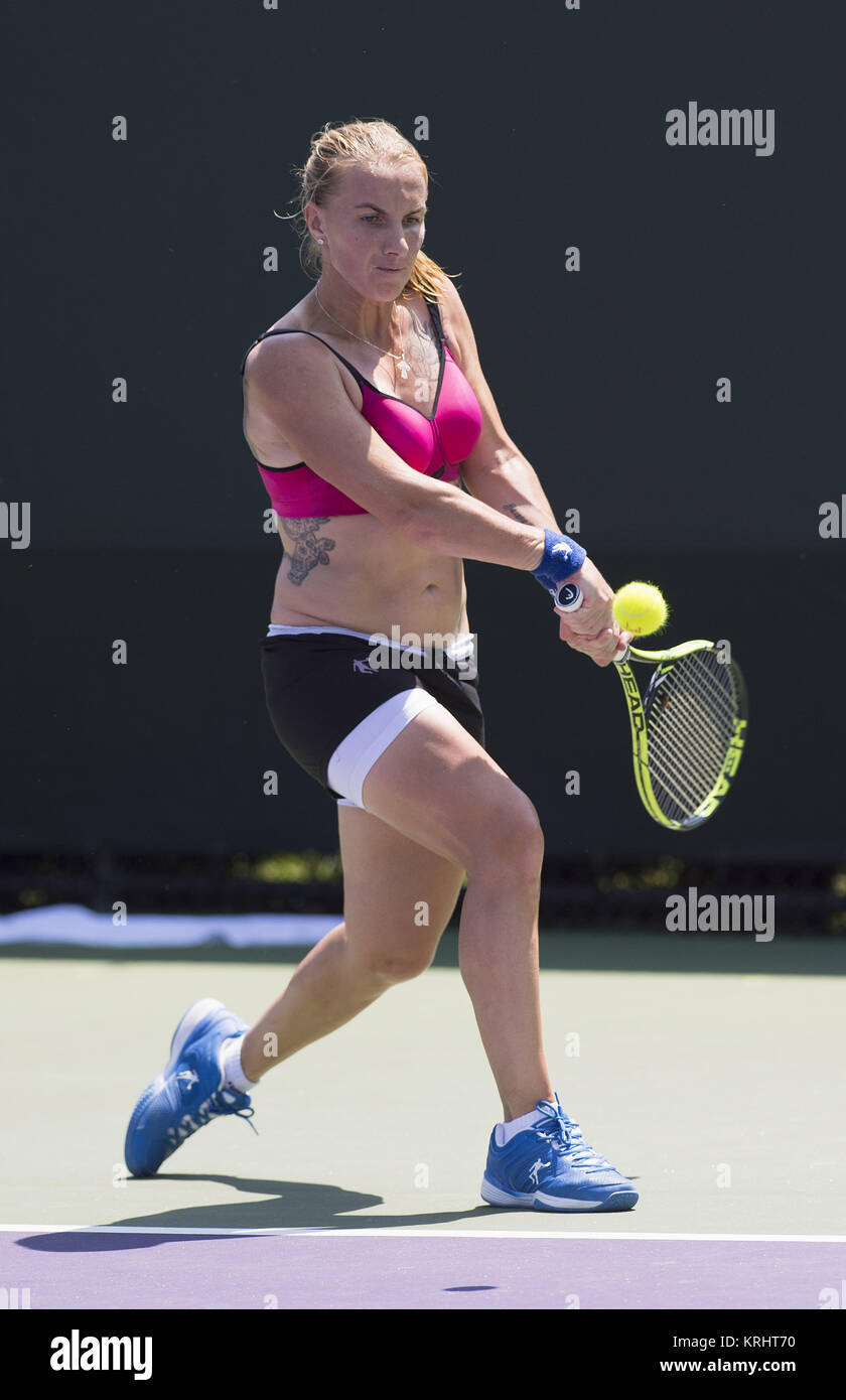 Svetlana Kuznetsova Delivering A Powerful Double-handed Stroke During A Tennis Match Background