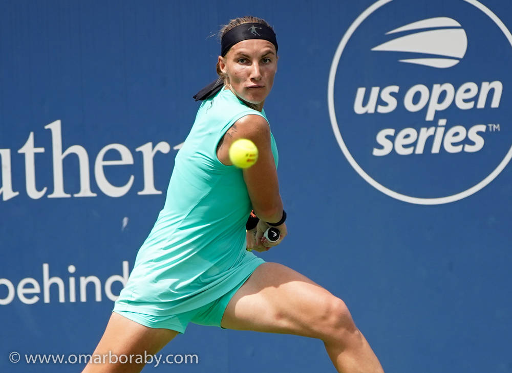 Svetlana Kuznetsova In Action During The Us Open Series Tournament. Background