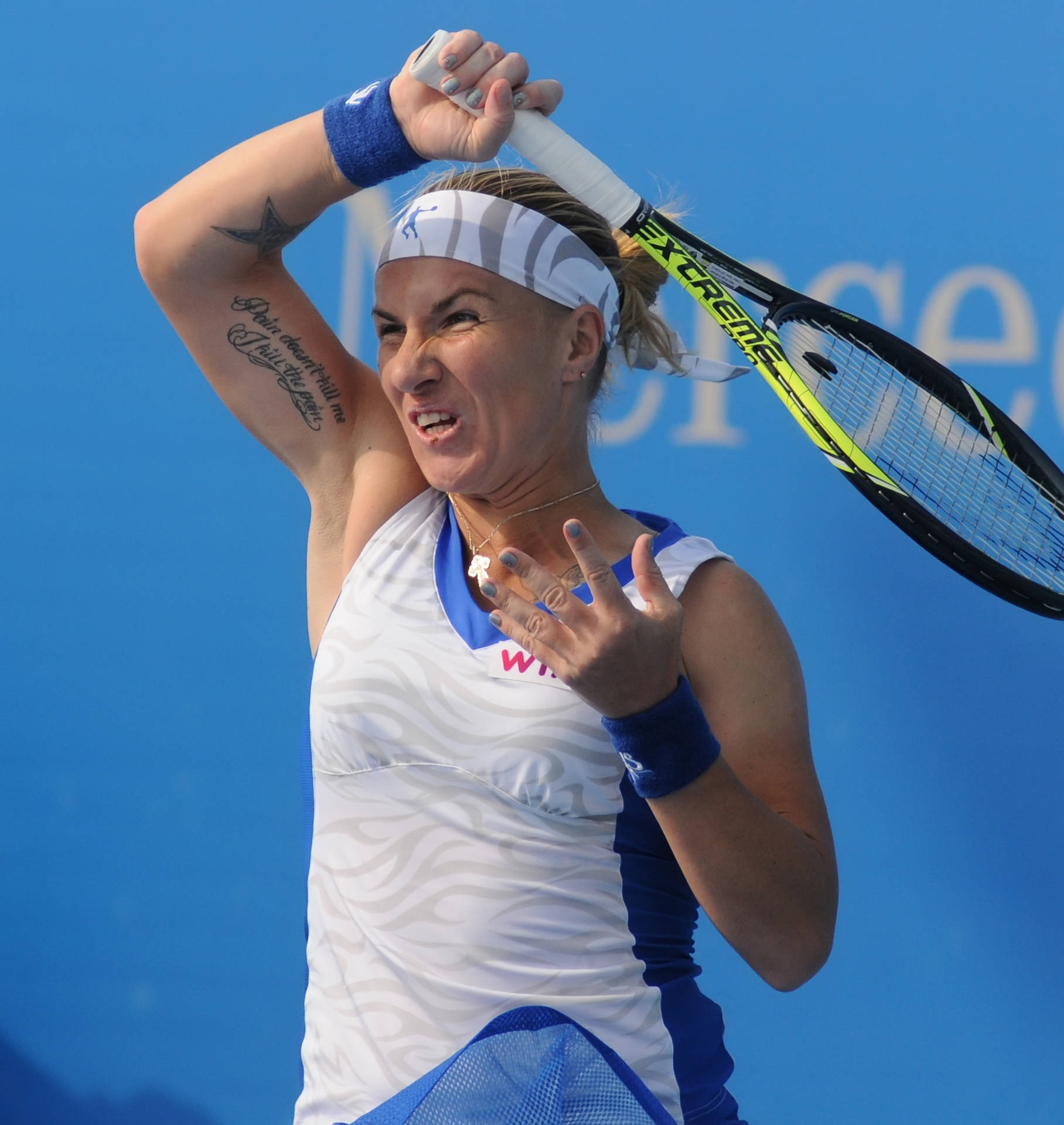 Svetlana Kuznetsova Showing Intense Focus During A Tennis Match. Background