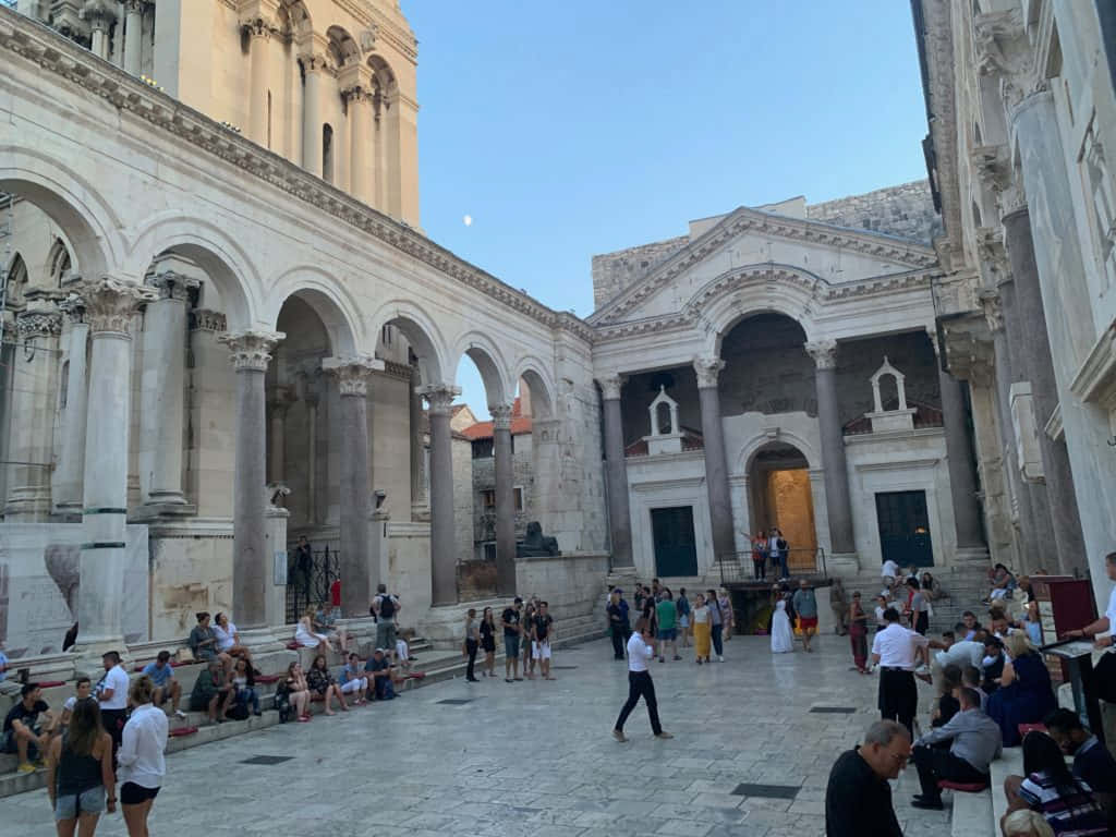 Swarm Of People At Diocletians Palace Background