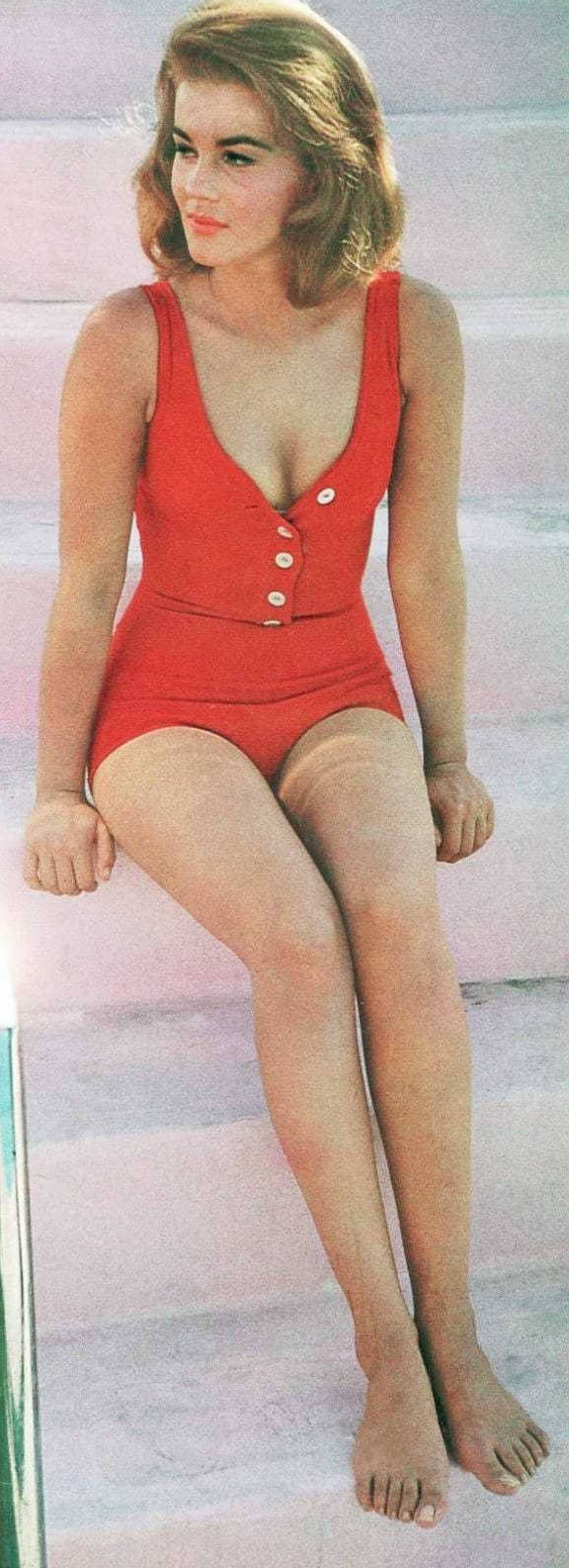 Swedish-american Celebrity Ann Margret Radiating Elegance In Swimsuit Background