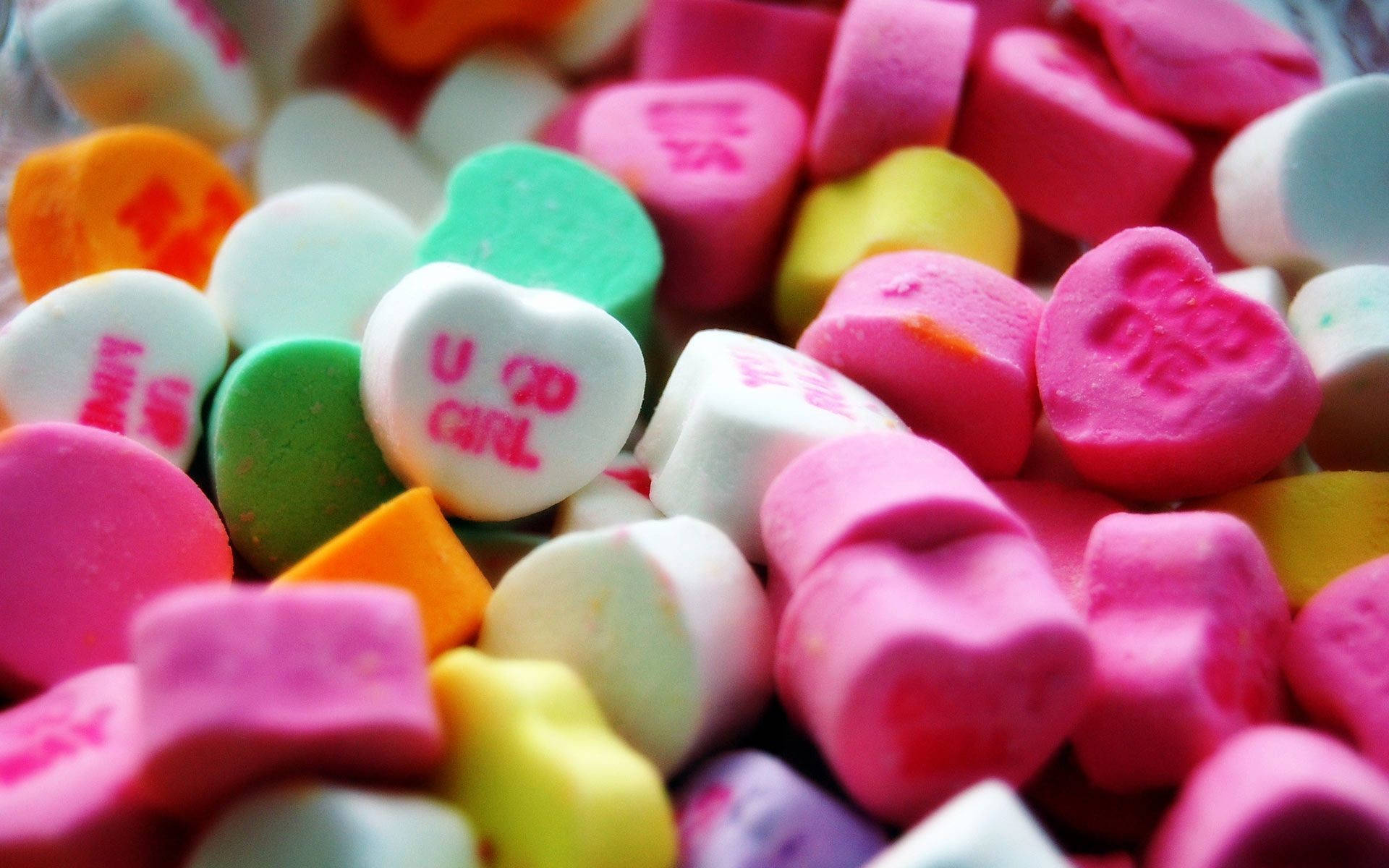 Sweet Heart-shaped Candies With Texts Background