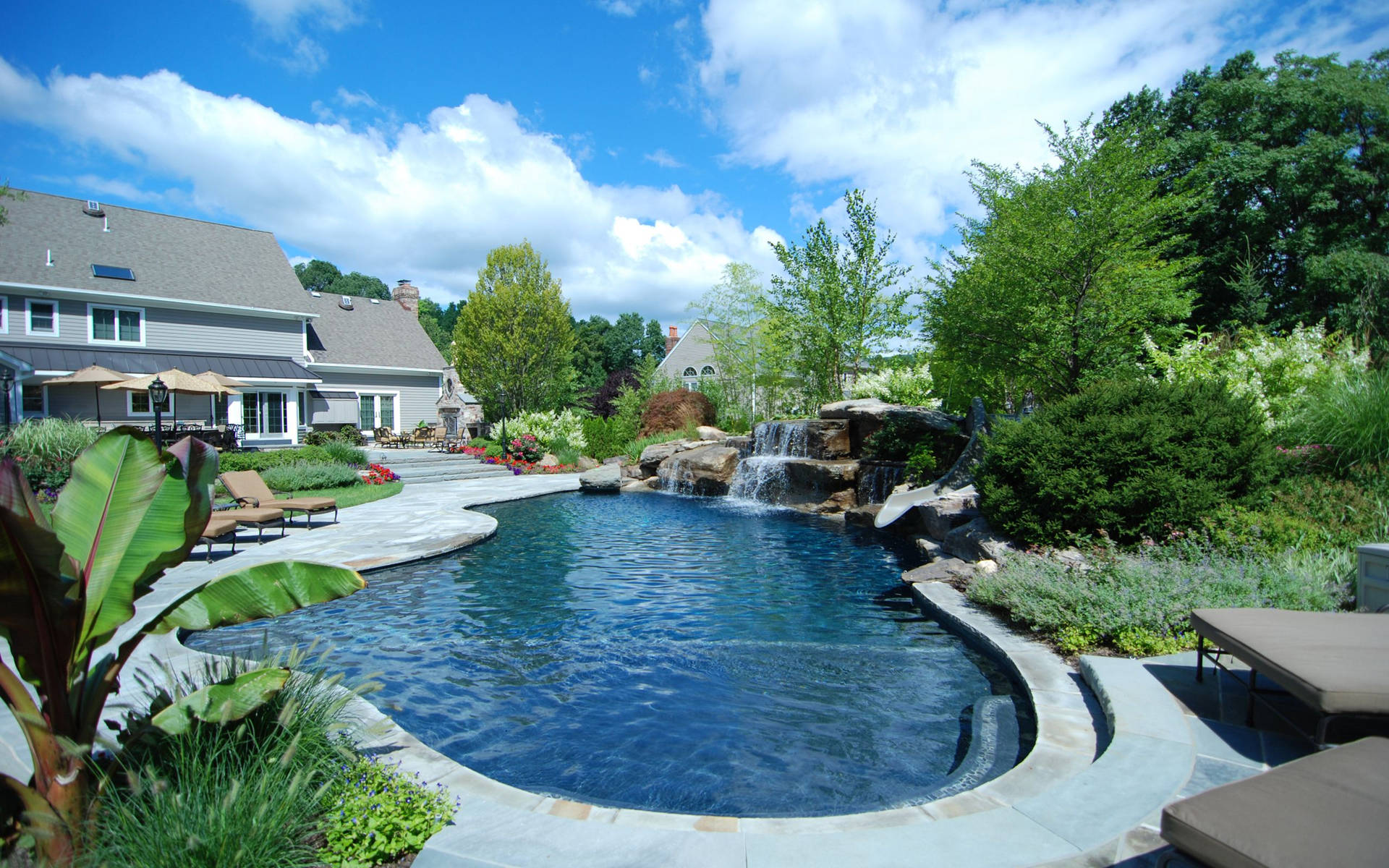 Swimming Pool With Man-made Falls Background