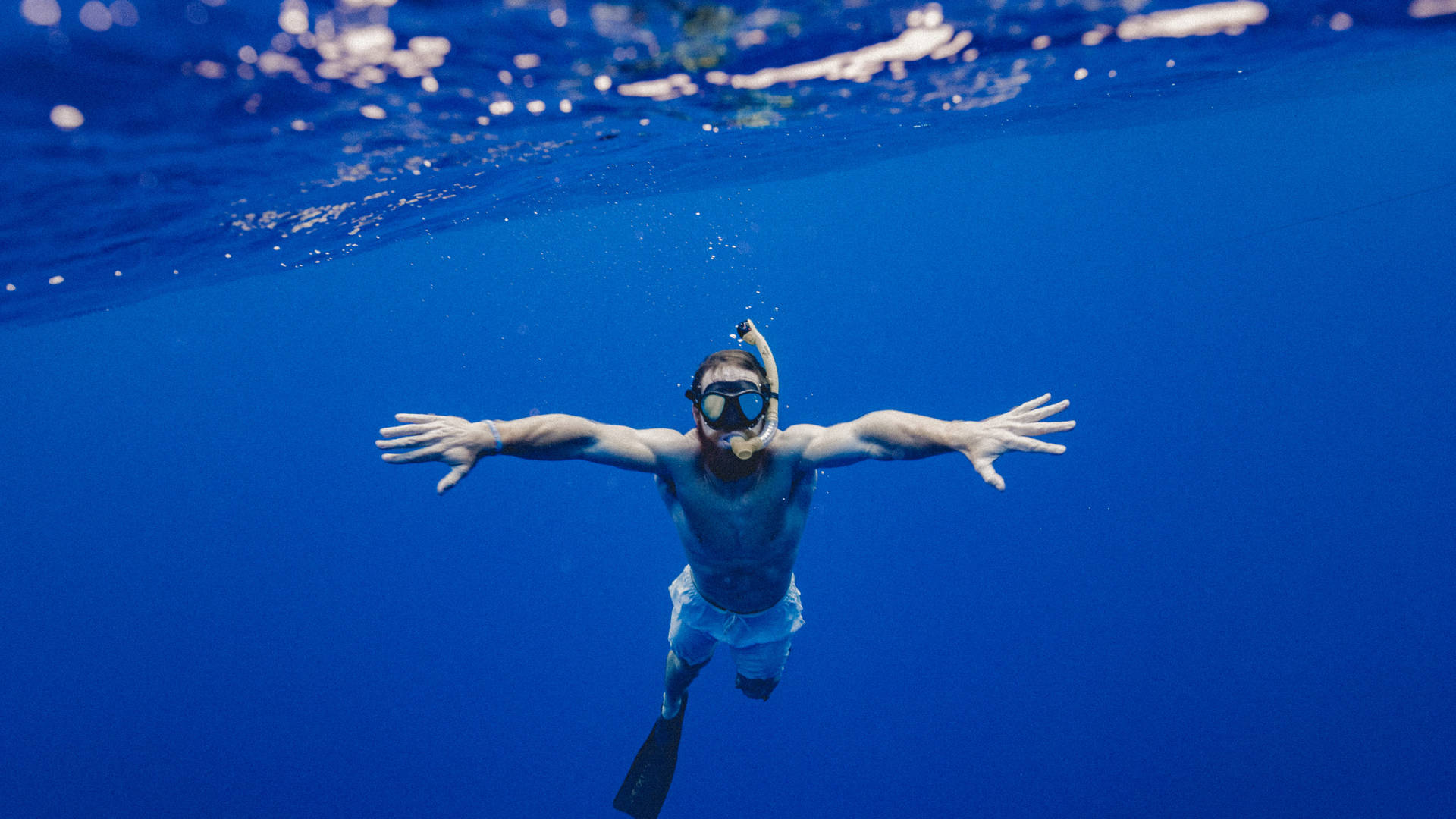 Swimming Under Deep Blue Ocean Background